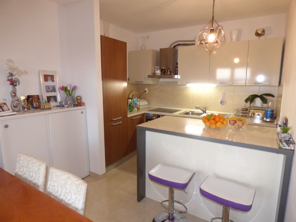 Dining area and kitchen of apartment A1493 in Croatia, Ciovo Island.