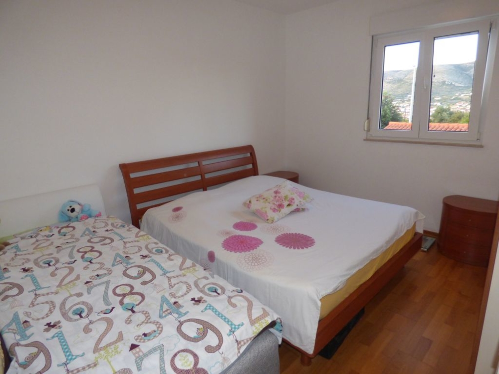 The bedroom with a view of the city of Trogir in Croatia.