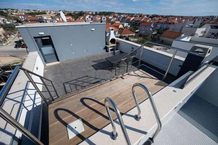 Roof terrace with pool and view of Zadar in Croatia