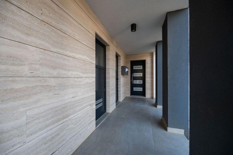House entrance with natural stone cladding