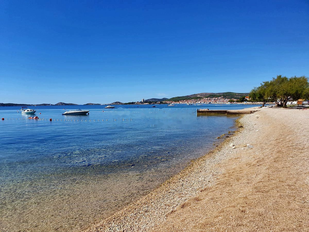 Bay at Srima with boats and a bathing beach