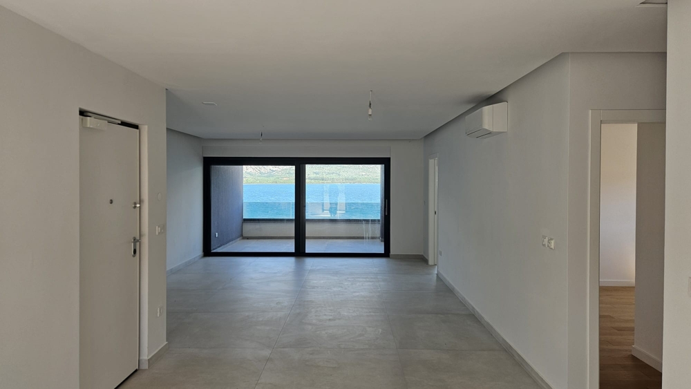 Living room in the modern new building in the first row to the sea with great sea views.