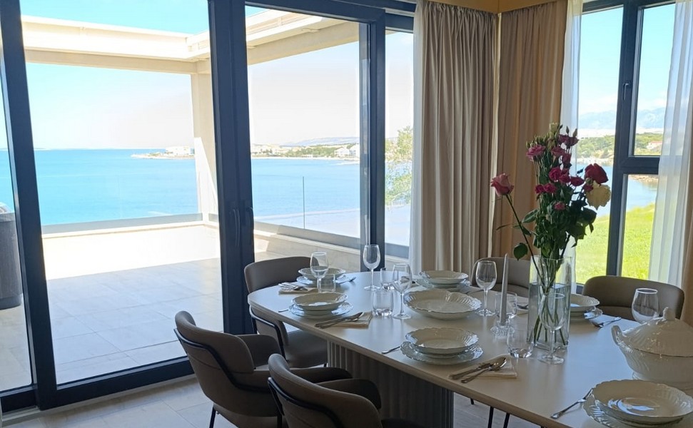 View from the air-conditioned living room to the terrace and the sea.