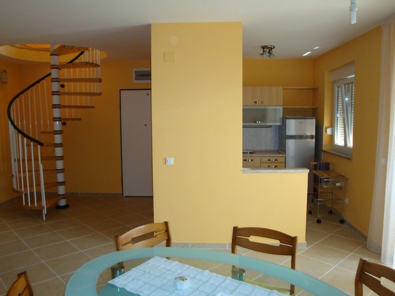 Dining area and stairs to upper floor - Apartment A2863, Croatia.