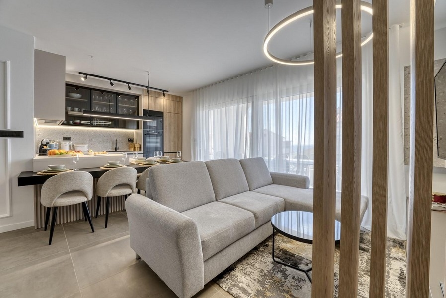 Luxurious living area and view of the modern fitted kitchen.