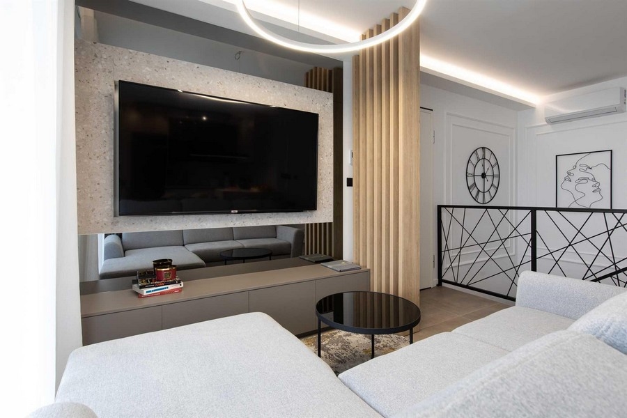 Living room with large TV in the property.