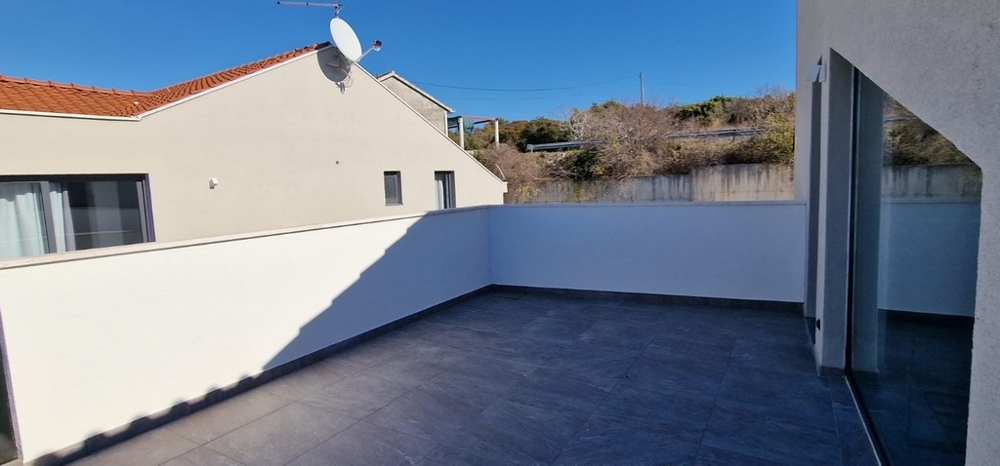 Large terrace of apartment A3058 in Croatia in the village of Sutivan.