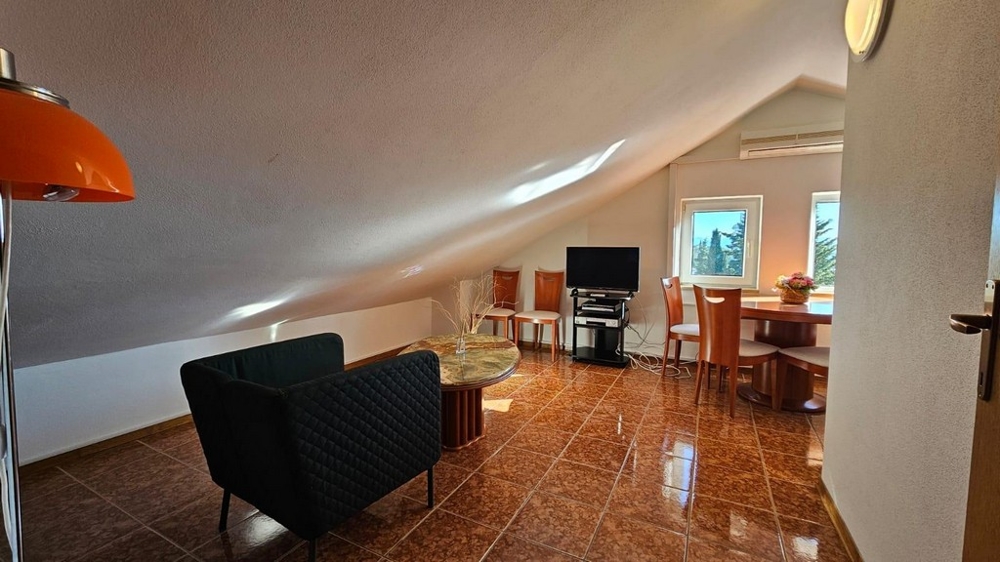 Living room under the roof of a property in Croatia with comfortable sofas