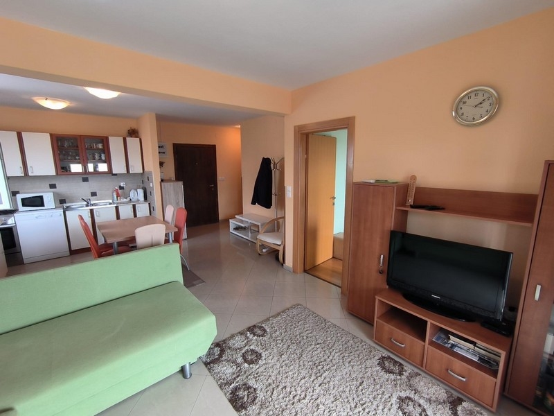 Living room of an apartment for sale in Croatia, open plan with kitchen and dining area.