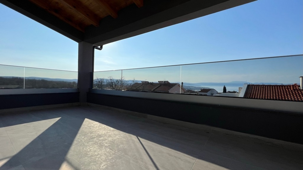 Impressive sea views from a spacious terrace, a highlight for those interested in real estate in Croatia.