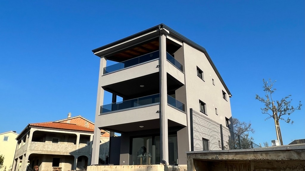 Modern new build with attractive balconies, representing the contemporary architecture of the property on Krk Island.