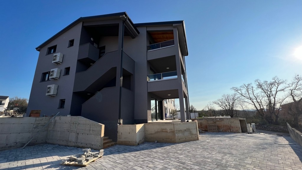 View of the rear of the residential building, showing the quiet location of the property on Krk Island.