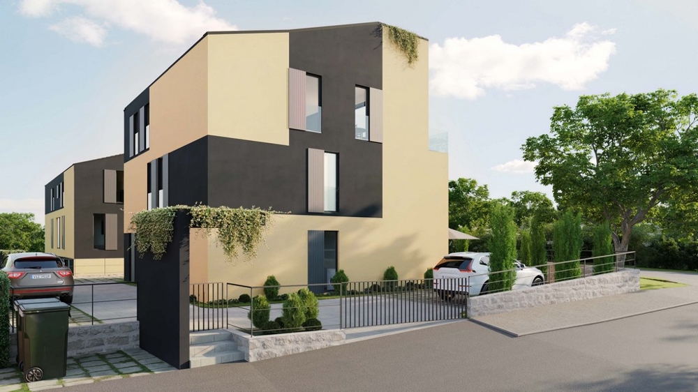 Perspective from the street of a modern apartment house with a dark facade, surrounded by cypress trees and a stone wall, in an idyllic setting - real estate Croatia, buy an apartment on the island of Krk.