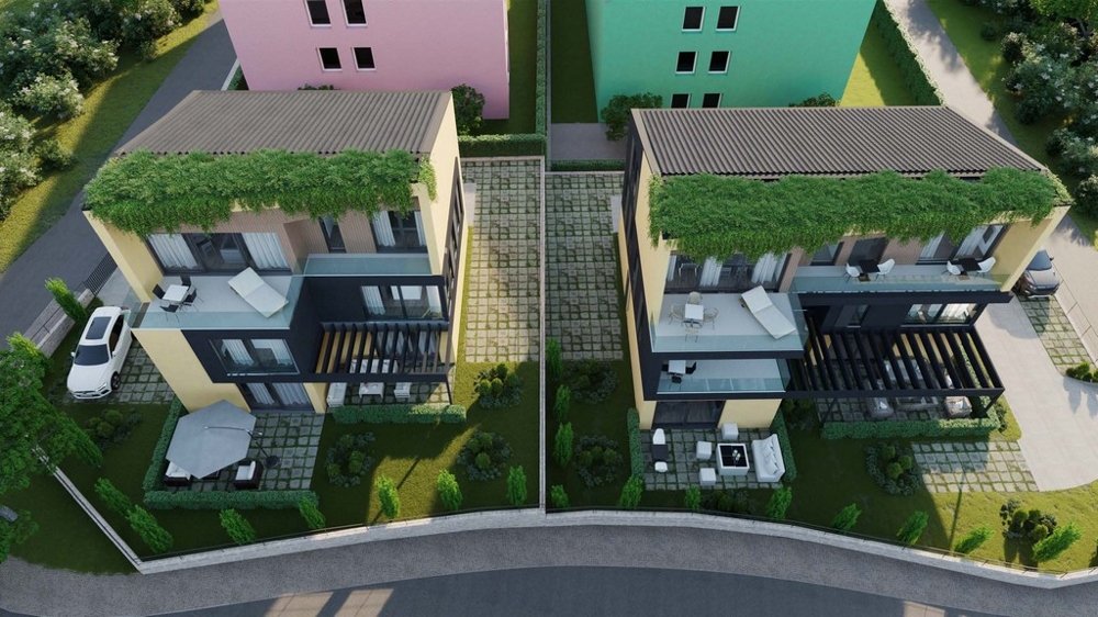 Top view of two modern apartments in Croatia with green roofs, terraces, parking spaces and carefully landscaped gardens