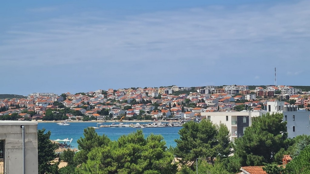 Panoramic view of Novalja, Pag island, overlooking apartments and the blue sea coast, Croatia real estate