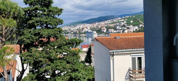 View of the city center and the sea from a balcony in the apartment in Selce, Crikvenica