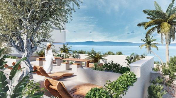Real estate in Croatia, Makarska, apartment with sea view: Woman in white dress relaxing on a roof terrace with wooden furniture and looking at the sea