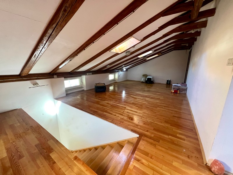 Stairs lead from the attic to the lower part of the apartment.