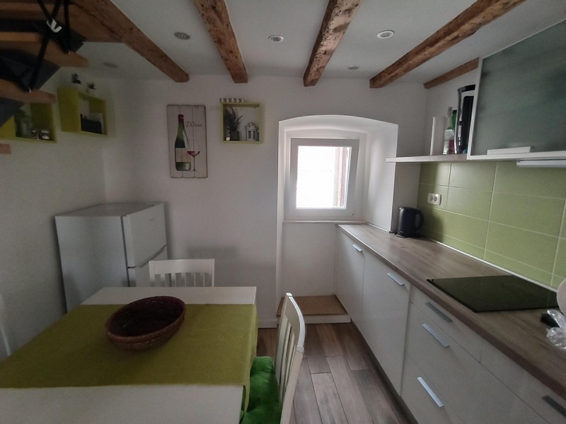 Kitchen and dining area of ​​apartment A3396, which is for sale in Baska on the island of Krk.