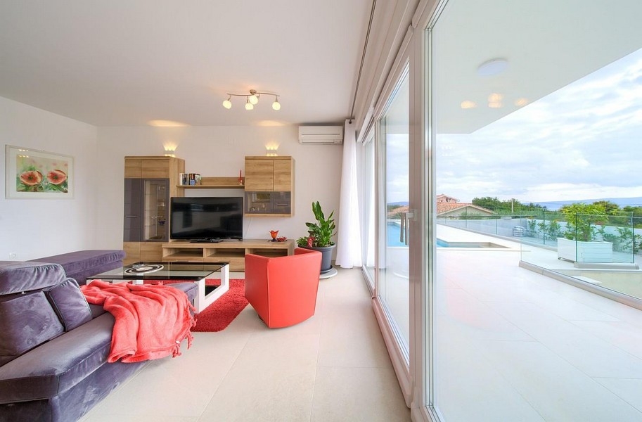 Furnished living room with access to the spacious terrace of property A3445, Croatia.