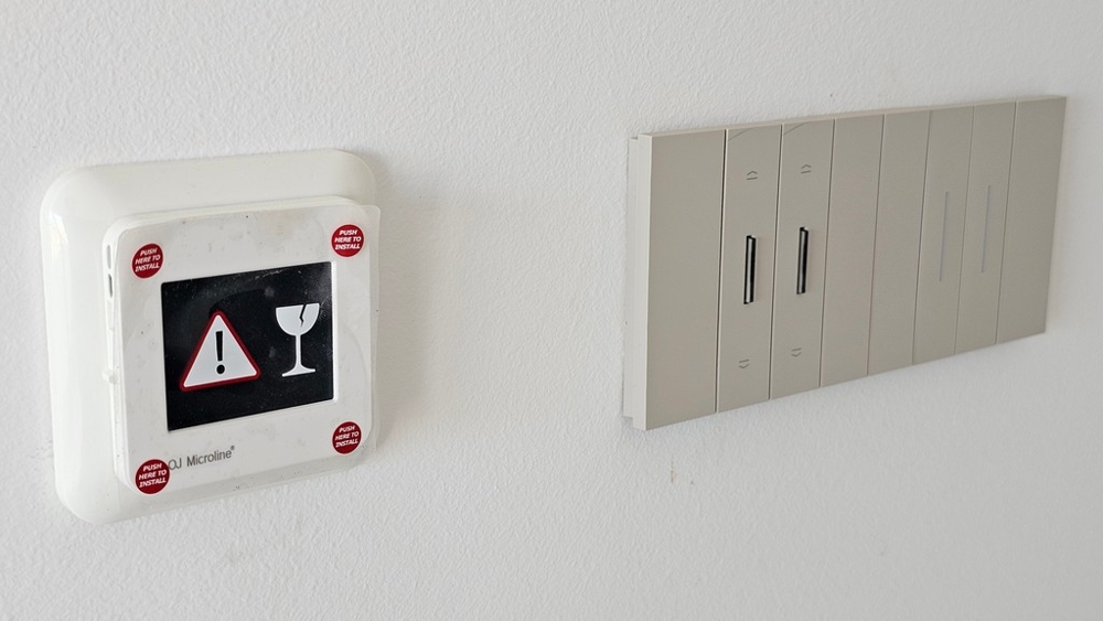 Room thermostat and modern light switches in the new apartment A3479, Vrbnik