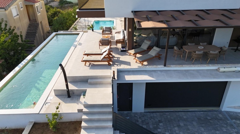 Large sun terrace with pool and sea views