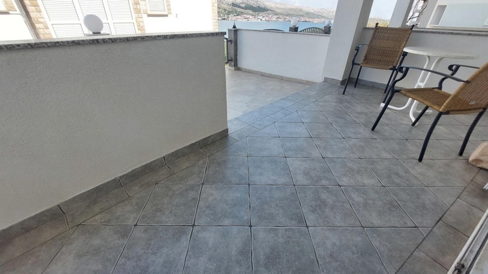 Terrace of the ground floor apartment A3640 in PAG in Croatia.