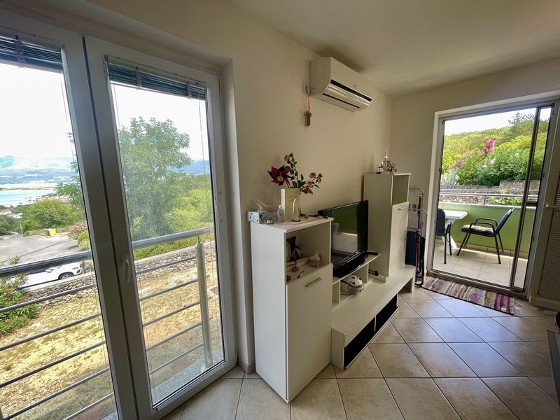 Furnished living area with a view of the sea.