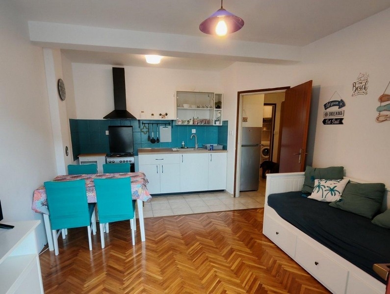 Living area with integrated kitchen of the property A3703 in Novi Vinodolski, Kvarner Bay.