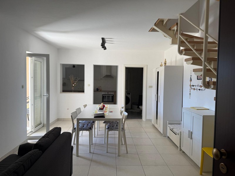 Living and dining area on the lower floor of the property A3750.