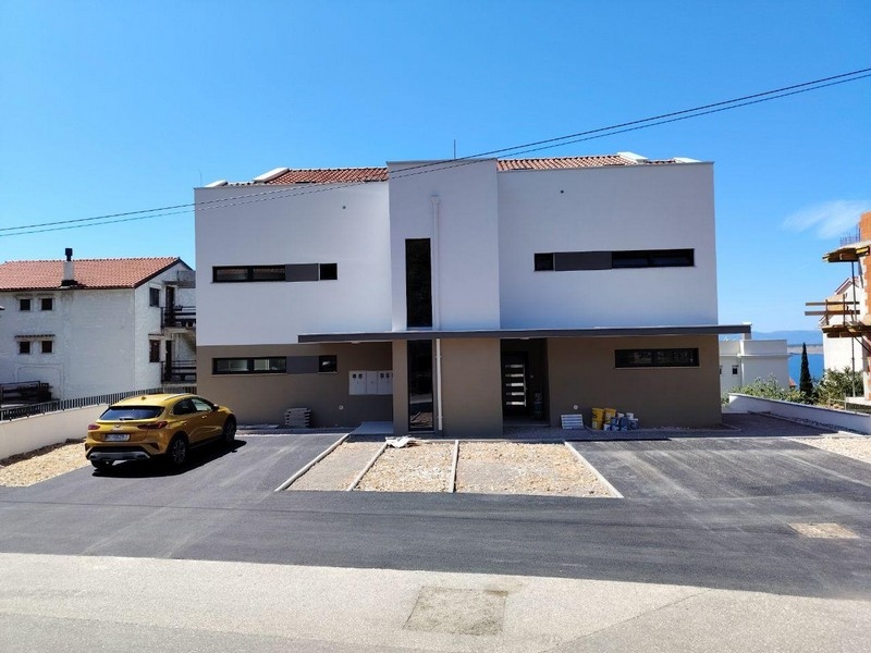 New building building with parking spaces in front of the house