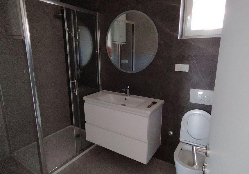 Modern bathroom with shower and washbasin
