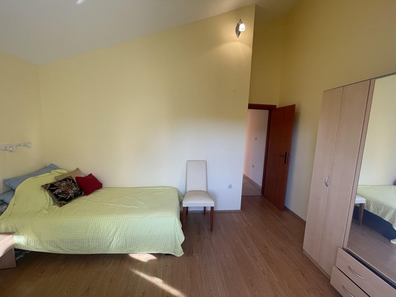 Bright bedroom with wardrobe and seating