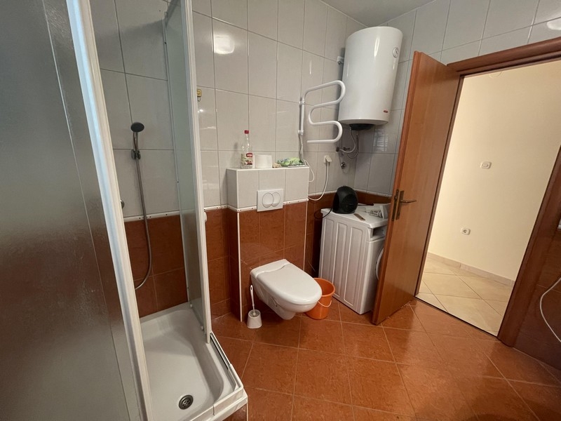 Bathroom with washing machine and hot water boiler