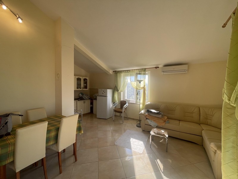 Living room with bright furnishings and air conditioning