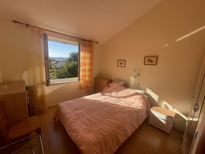 Bedroom with double bed and window with view