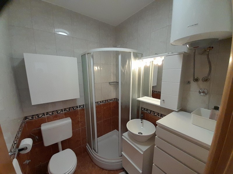 Bathroom with shower, sink and toilet