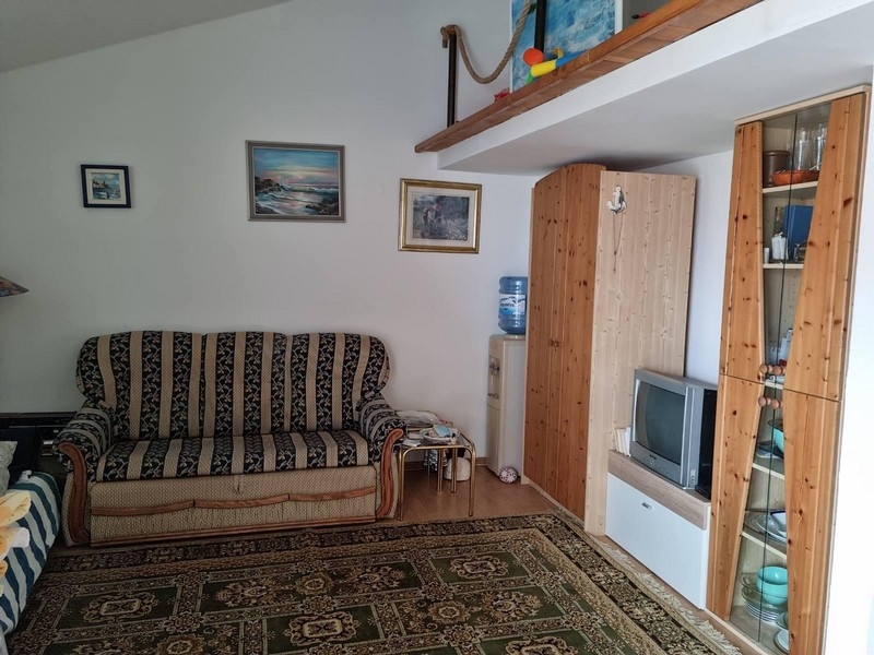 Living room with sofa and wooden cupboard