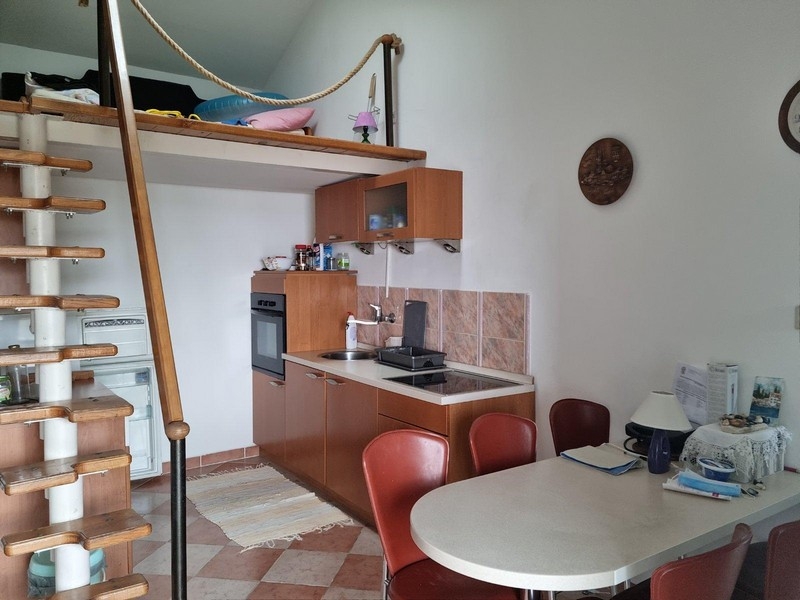 Kitchen area with dining area and gallery