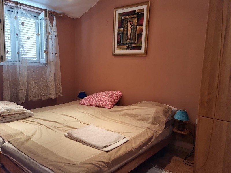 Bedroom with window and double bed