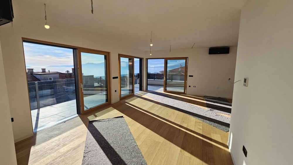 Living room with floor-to-ceiling windows and views of the sea in Rijeka