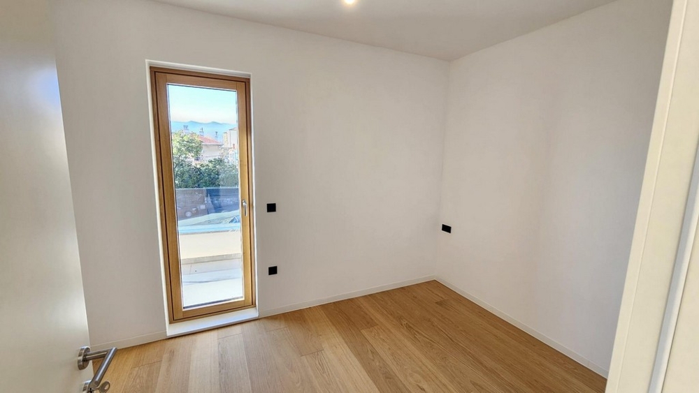 Bedroom with floor-to-ceiling window