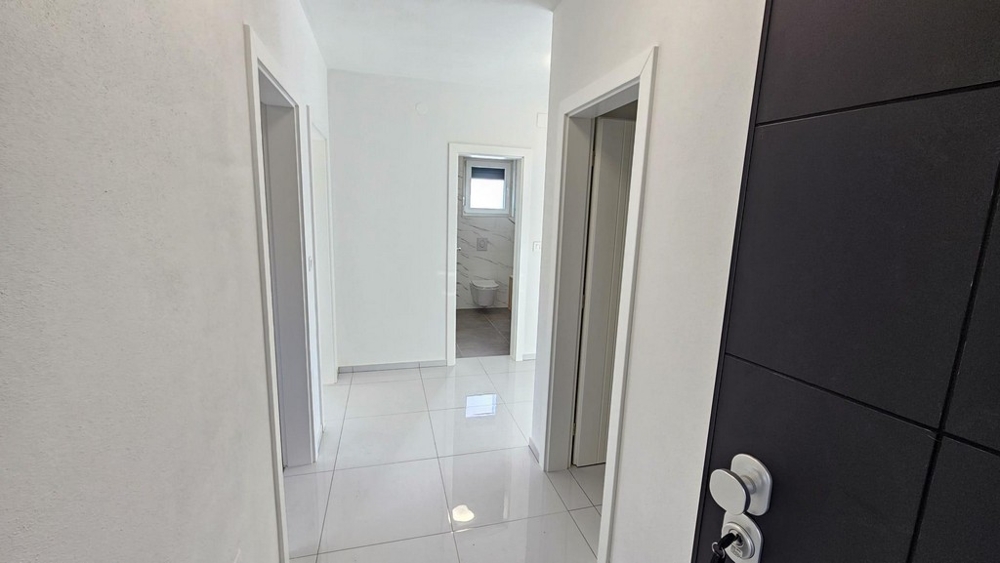 Hallway with a view of the bathroom