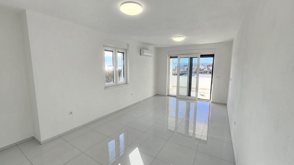 Bright living room with balcony access