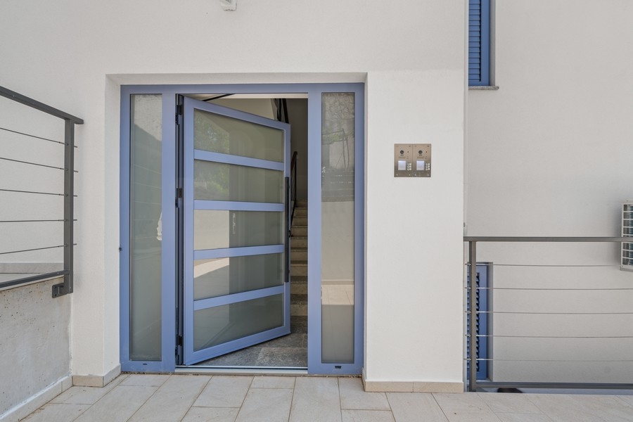 House entrance with modern entrance door and staircase