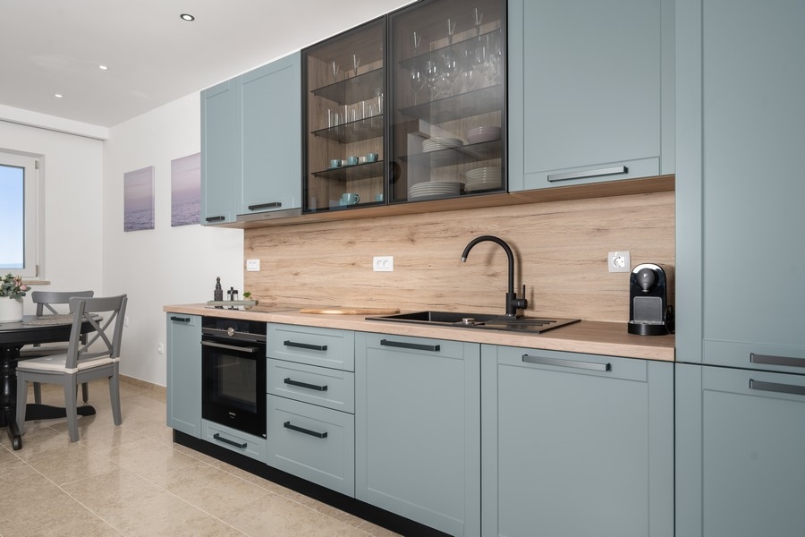 Modern fitted kitchen with work surface and electrical appliances