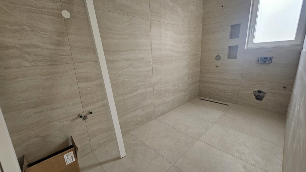 Modern bathroom with floor-level shower