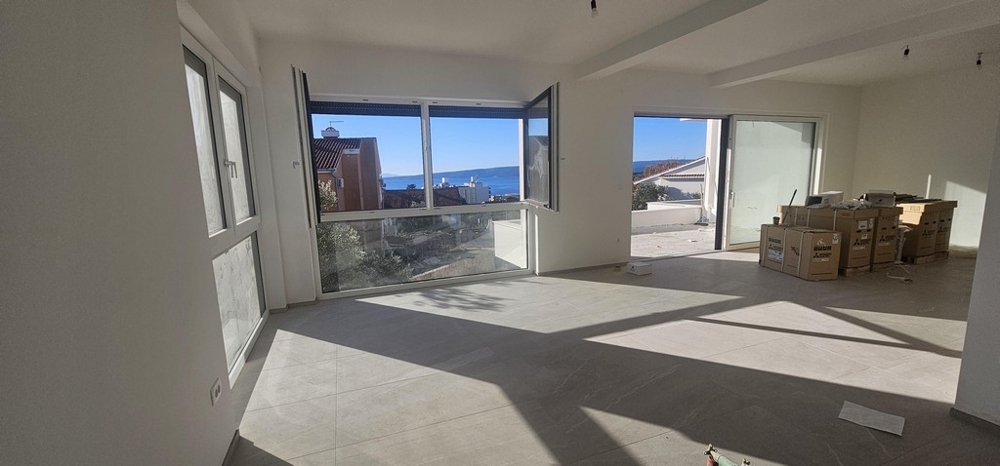 Living room with large windows and sea views