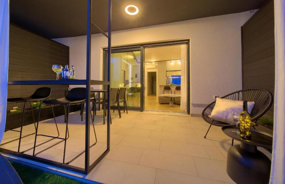 Modern terrace with seating area and access to the living room