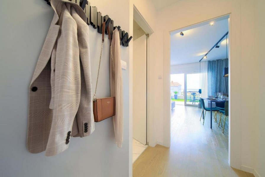 Hallway with wardrobe and view into the living area